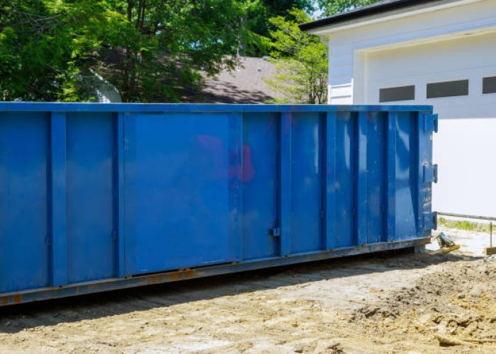 metal trash construction garbage dumpsters on metal container house renovation.